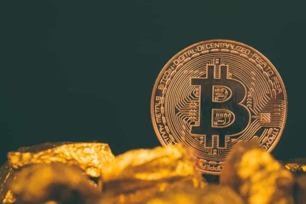 The illustration of Bitcoin (BTC) as a physical gold coin