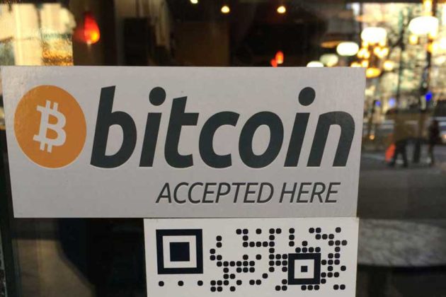 A sign that explains if businesses accept Bitcoin in Australia as a payment method
